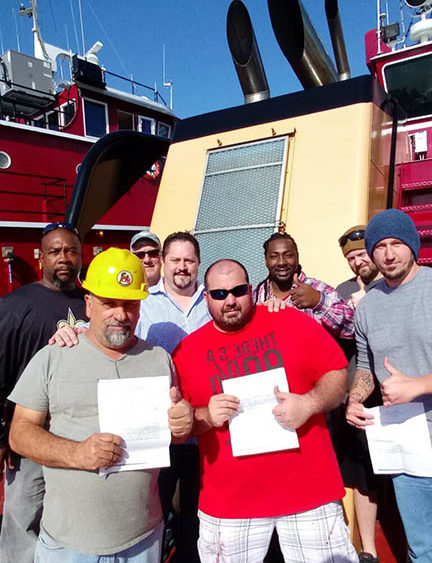 Group photo of members on boat