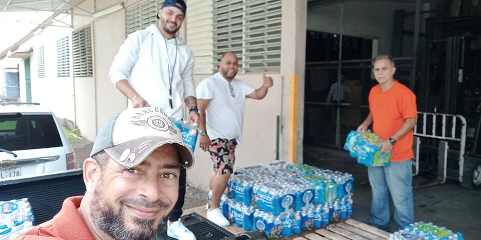 Photo of people in Puerto Rico receiving supplies for distribution