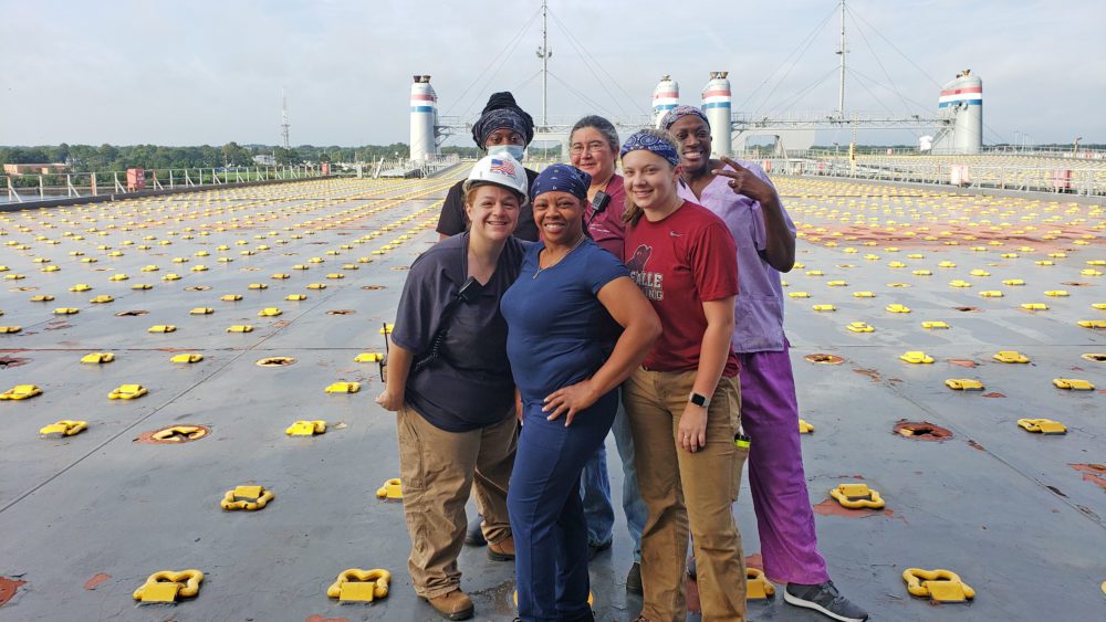 Group photo of mariners aboard ship