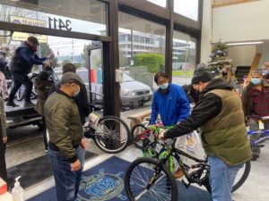 Photo of members loading bikes and other gifts