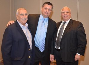 Group photo including John Natoli and two others