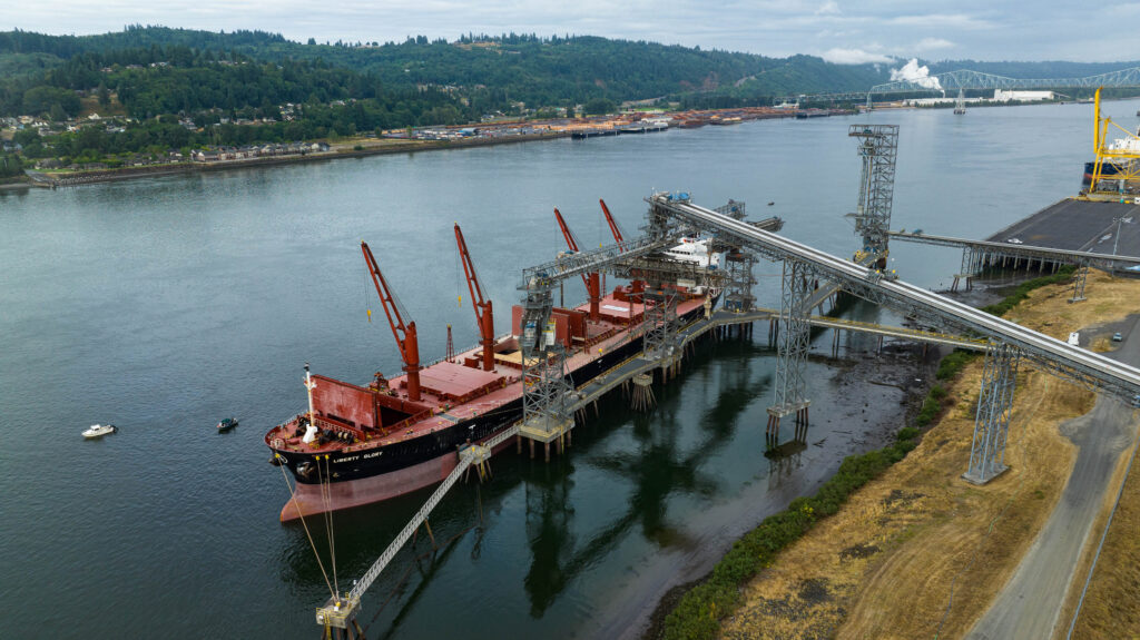 Three-quarters-overhead photo of ship at pier