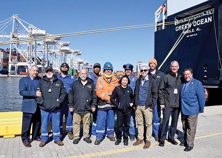Group photo of SIU personnel near vessel
